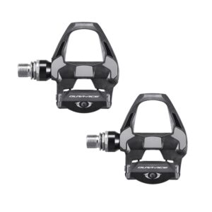 Pair of black and gray Dura-Ace clipless bicycle pedals with threaded axles (two pedals shown).