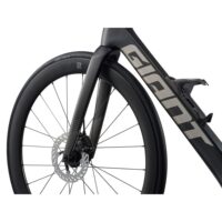 Close-up of a black Foil road bike front wheel with disc brake rotor and fork visible.