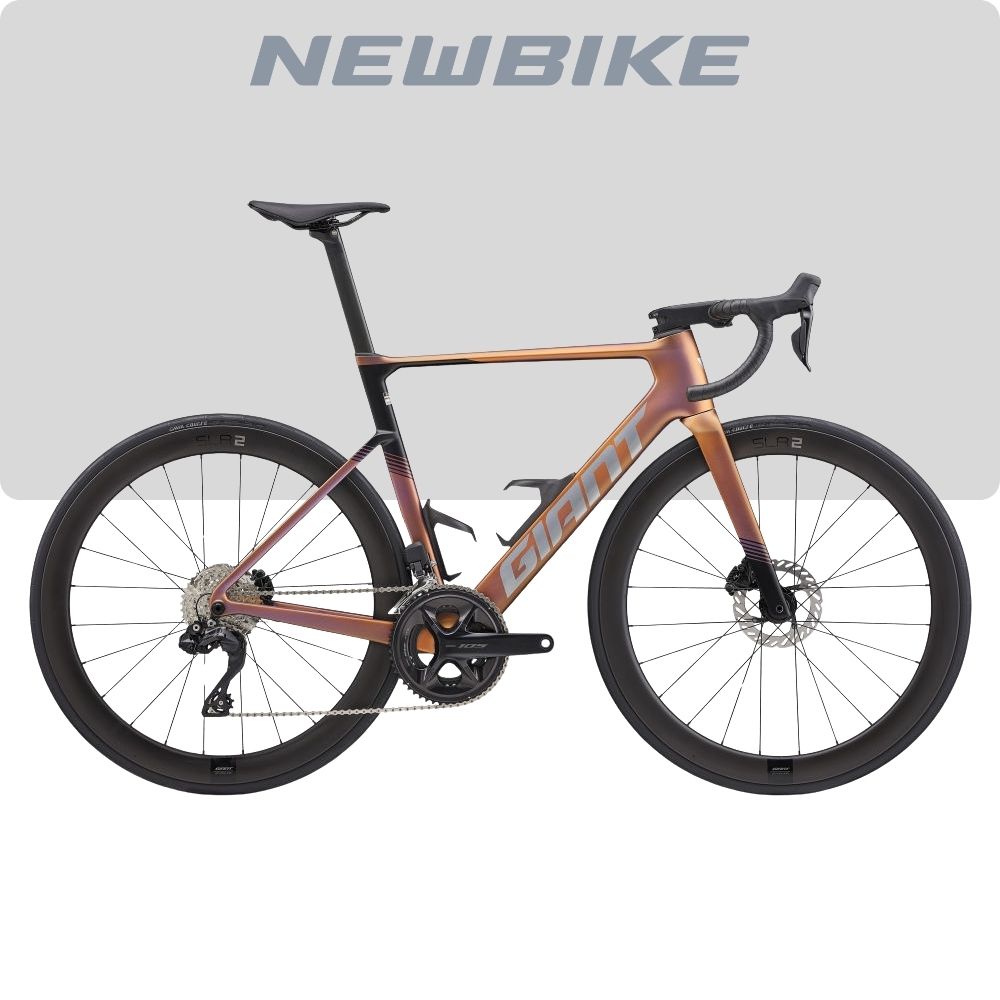 Copper-to-rose road bike with drop handlebars and disc brakes, branded NEWBIKE, shown full side view