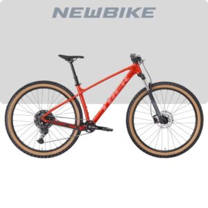 Red hardtail mountain bike with tan-wall tires and front suspension, shown in profile against a light gray backdrop.