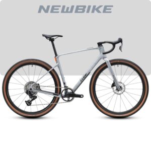 Silver gravel bike with drop handlebars and brown tires on a light background; NEWBIKE logo above.