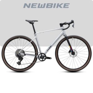 Silver NewBike gravel bike with drop handlebars, 1x drivetrain, and tan-wall tires, shown against a light gray background
