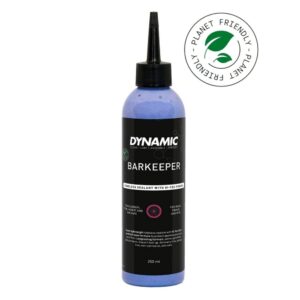 Dynamic Barkeeper tubeless sealant bottle with blue liquid and a 'Planet Friendly' stamp, 250 ml capacity.